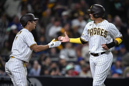 Jun 5, 2023; San Diego, California, USA; San Diego Padres third baseman Manny Machado (13) is congratulated by shortstop Ha-seong Kim (7) after scoring a run against the Chicago Cubs during the eighth inning at Petco Park. Mandatory Credit: Orlando Ramirez-USA TODAY Sports