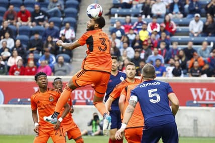 Jun 6, 2023; Bridgeview, IL, USA; Houston Dynamo defender Micael (31) heads the ball against the Chicago Fire during the first half at SeatGeek Stadium. Mandatory Credit: Mike Dinovo-USA TODAY Sports