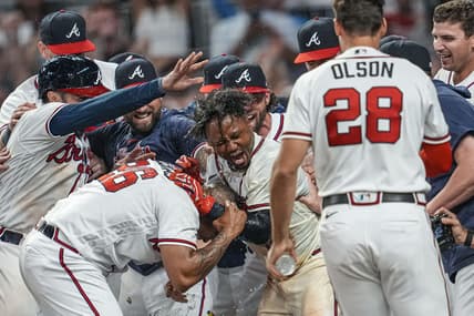 Jun 8, 2023; Cumberland, Georgia, USA; Atlanta Braves players react with second baseman Ozzie Albies (1) after his game winning three run home run against the New York Mets during the tenth inning at Truist Park. Mandatory Credit: Dale Zanine-USA TODAY Sports