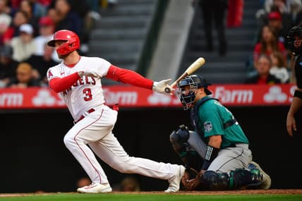 Jun 9, 2023; Anaheim, California, USA; Los Angeles Angels left fielder Taylor Ward (3) reaches first on a fielding error by Seattle Mariners shortstop J.P. Crawford (3) during the third inning at Angel Stadium. Mandatory Credit: Gary A. Vasquez-USA TODAY Sports