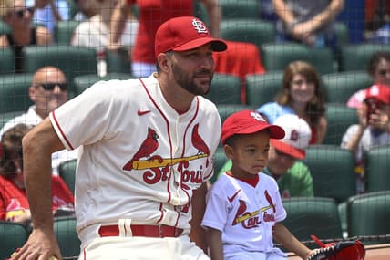 Jun 10, 2023; St. Louis, Missouri, USA; St. Louis Cardinals starting pitcher Adam Wainwright (50) and his son Caleb look on prior to a ceremonial first pitch before a game against the Cincinnati Reds at Busch Stadium. Mandatory Credit: Joe Puetz-USA TODAY Sports