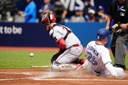 Jun 10, 2023; Toronto, Ontario, CAN;  Minnesota Twins catcher Ryan Jeffers (27) takes the throw as Toronto Blue Jays third baseman Matt Chapman (26) scores on a single by Toronto second baseman Whit Merrifield (not pictured) during the second inning at Rogers Centre. Mandatory Credit: John E. Sokolowski-USA TODAY Sports