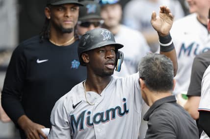 Jun 10, 2023; Chicago, Illinois, USA; Miami Marlins center fielder Jonathan Davis (49) celebrates with teammates after scoring against the Chicago White Sox during the ninth inning at Guaranteed Rate Field. Mandatory Credit: Kamil Krzaczynski-USA TODAY Sports