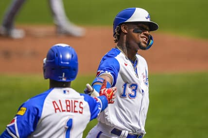 Jun 10, 2023; Cumberland, Georgia, USA; Atlanta Braves right fielder Ronald Acuna Jr. (13) reacts with second baseman Ozzie Albies (1) after scoring a run against the Washington Nationals during the first inning at Truist Park. Mandatory Credit: Dale Zanine-USA TODAY Sports