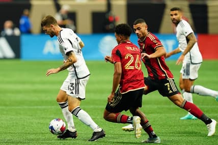 Jun 10, 2023; Atlanta, Georgia, USA; D.C. United midfielder Mateusz Klich (43) controls the ball against Atlanta United players during the first half at Mercedes-Benz Stadium. Mandatory Credit: John David Mercer-USA TODAY Sports