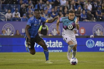 Jun 10, 2023; Montreal, Quebec, CAN; Minnesota United midfielder Hassani Dotson (31) plays the ball defended by CF Montreal midfielder Victor Wanyama (2) in the second half at Stade Saputo. Mandatory Credit: Eric Bolte-USA TODAY Sports