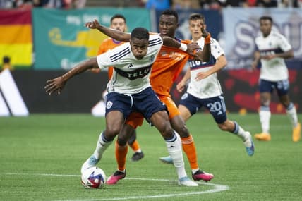 Jun 10, 2023; Vancouver, British Columbia, CAN;  Vancouver Whitecaps FC forward Sergio Cordova (9) and FC Cincinnati midfielder Obinna Nwobodo (5) battle for the ball during the first half at BC Place. Mandatory Credit: Anne-Marie Sorvin-USA TODAY Sports