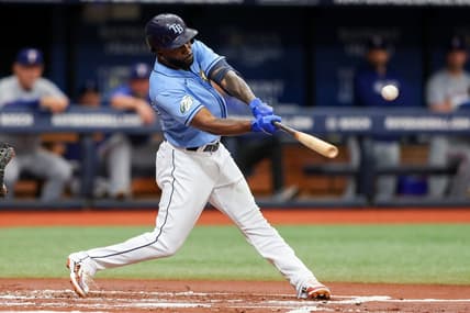 Jun 11, 2023; St. Petersburg, Florida, USA;  Tampa Bay Rays left fielder Randy Arozarena (56) hits an rbi single against the Texas Rangers in the first inning at Tropicana Field. Mandatory Credit: Nathan Ray Seebeck-USA TODAY Sports