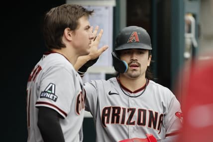 Jun 11, 2023; Detroit, Michigan, USA;  Arizona Diamondbacks left fielder Corbin Carroll (7) receives congratulations from teammates after scoring against the Detroit Tigers at Comerica Park. Mandatory Credit: Rick Osentoski-USA TODAY Sports