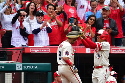 June 11, 2023; Anaheim, California, USA; Los Angeles Angels shortstop Zach Neto (9) receives the kabuto helmet after hitting a solo home run against the Seattle Mariners during the eighth inning at Angel Stadium. Mandatory Credit: Gary A. Vasquez-USA TODAY Sports