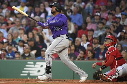 Jun 13, 2023; Boston, Massachusetts, USA; Colorado Rockies catcher Elias Diaz (35) hits an RBI double during the third inning against the Boston Red Sox at Fenway Park. Mandatory Credit: Bob DeChiara-USA TODAY Sports