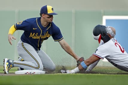 Jun 13, 2023; Minneapolis, Minnesota, USA; Milwaukee Brewers shortstop Willy Adames (27) tags out Minnesota Twins third baseman Royce Lewis (23) who tried to extend a single into a double in the second inning at Target Field. Mandatory Credit: Bruce Kluckhohn-USA TODAY Sports