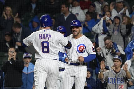 Jun 13, 2023; Chicago, Illinois, USA; Chicago Cubs left fielder Ian Happ (8) is greeted by center fielder Mike Tauchman (40) after hitting a three run homer against the Pittsburgh Pirates during the first inning at Wrigley Field. Mandatory Credit: David Banks-USA TODAY Sports