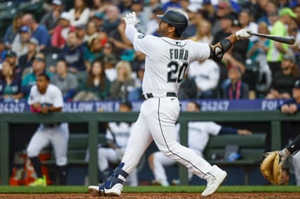 Jun 13, 2023; Seattle, Washington, USA; Seattle Mariners designated hitter Mike Ford (20) hits a two-run home run against the Miami Marlins during the fourth inning at T-Mobile Park. Mandatory Credit: Joe Nicholson-USA TODAY Sports