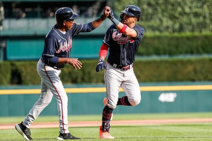 Atlanta Braves left fielder Eddie Rosario (8) celebrates with third base coach Ron Washington (37) after hitting a homer against the Detroit Tigers during the sixth inning of Game 2 of the doubleheader at Comerica Park in Detroit on Wednesday, June 14, 2023.