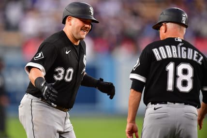 Jun 14, 2023; Los Angeles, California, USA; Chicago White Sox third baseman Jake Burger (30) is greeted by third base coach Eddie Rodriguez (18) after hitting a solo home run against the Los Angeles Dodgers during the second inning at Dodger Stadium. Mandatory Credit: Gary A. Vasquez-USA TODAY Sports