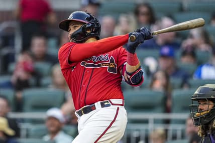 Jun 16, 2023; Cumberland, Georgia, USA; Atlanta Braves catcher Travis d'Arnaud (16) hits a home run against the Colorado Rockies during the third inning at Truist Park. Mandatory Credit: Dale Zanine-USA TODAY Sports