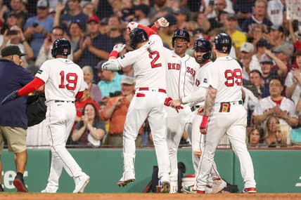 Jun 16, 2023; Boston, Massachusetts, USA; Boston Red Sox designated hitter Justin Turner (2) celebrates with teammates after hitting a grand slam during the third inning against the New York Yankees at Fenway Park. Mandatory Credit: Paul Rutherford-USA TODAY Sports