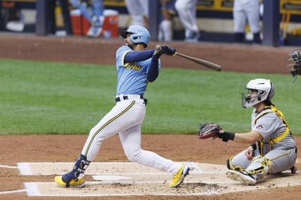 Jun 16, 2023; Milwaukee, Wisconsin, USA;  Milwaukee Brewers right fielder Blake Perkins (16) hits an RBI single during the first inning against the Pittsburgh Pirates at American Family Field. Mandatory Credit: Jeff Hanisch-USA TODAY Sports
