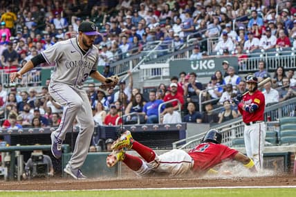 Jun 16, 2023; Cumberland, Georgia, USA; Atlanta Braves right fielder Ronald Acuna Jr. (13) scores under Colorado Rockies starting pitcher Dinelson Lamet (32) after a wild pitch during the first inning at Truist Park. Mandatory Credit: Dale Zanine-USA TODAY Sports