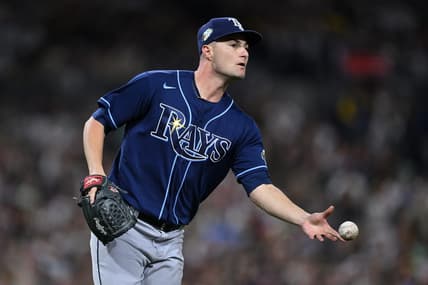 Jun 16, 2023; San Diego, California, USA; Tampa Bay Rays starting pitcher Shane McClanahan (18) tosses the ball to first base on a ground out by San Diego Padres left fielder Juan Soto (not pictured) during the sixth inning at Petco Park. Mandatory Credit: Orlando Ramirez-USA TODAY Sports