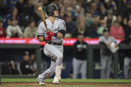 Jun 16, 2023; Seattle, Washington, USA; Chicago White Sox left fielder Andrew Benintendi (23) hits a solo home run off Seattle Mariners starting pitcher Bryan Woo (33) during the sixth inning at T-Mobile Park. Mandatory Credit: Stephen Brashear-USA TODAY Sports