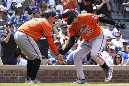 Jun 17, 2023; Chicago, Illinois, USA; Baltimore Orioles designated hitter  Adley Rutschman (35) is greeted by left fielder Austin Hays (21) after hitting a home run against the Chicago Cubs during the fifth inning at Wrigley Field. Mandatory Credit: David Banks-USA TODAY Sports