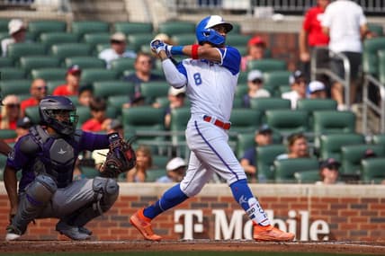 Jun 17, 2023; Atlanta, Georgia, USA; Atlanta Braves left fielder Eddie Rosario (8) hits a two-run home run against the Colorado Rockies in the third inning at Truist Park. Mandatory Credit: Brett Davis-USA TODAY Sports