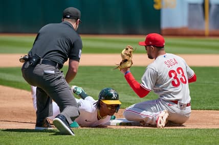 Jun 17, 2023; Oakland, California, USA; Oakland Athletics outfielder Esteury Ruiz (1) steals third base against Philadelphia Phillies infielder Edmundo Sosa (33) during the fourth inning at Oakland-Alameda County Coliseum. Mandatory Credit: Robert Edwards-USA TODAY Sports
