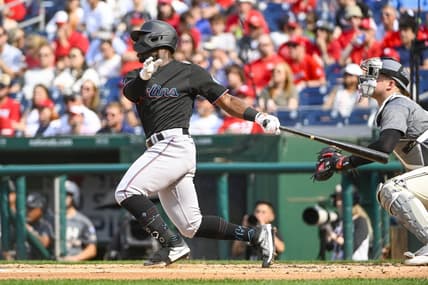 Jun 17, 2023; Washington, District of Columbia, USA; Miami Marlins center fielder Jonathan Davis (49) hits a RBI sacrifice fly against the Miami Marlins during the second inning at Nationals Park. Mandatory Credit: Brad Mills-USA TODAY Sports