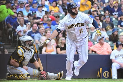 Jun 17, 2023; Milwaukee, Wisconsin, USA; Milwaukee Brewers first baseman Rowdy Tellez (11) hits a double to drive in two runs against the Pittsburgh Pirates in the fifth inning at American Family Field. Mandatory Credit: Benny Sieu-USA TODAY Sports