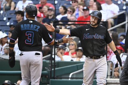 Jun 17, 2023; Washington, District of Columbia, USA; Miami Marlins shortstop Garrett Hampson (1) and second baseman Luis Arraez (3) celebrate after scoring against the Washington Nationals during the ninth inning at Nationals Park. Mandatory Credit: Brad Mills-USA TODAY Sports