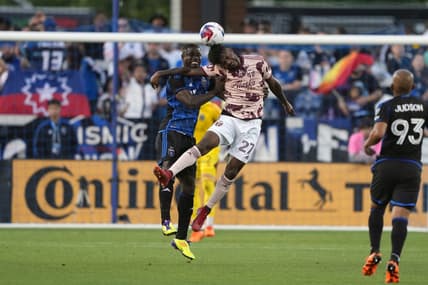 Jun 17, 2023; San Jose, California, USA; Portland Timbers forward Dairon Asprilla (27) and San Jose Earthquakes defender Jonathan Mensah (left) leap for the ball during the first half at PayPal Park. Mandatory Credit: Darren Yamashita-USA TODAY Sports