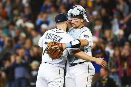 Jun 18, 2023; Seattle, Washington, USA; Seattle Mariners relief pitcher Ty Adcock (70) hugs catcher Cal Raleigh (29) following a 5-1 victory against the Chicago White Sox at T-Mobile Park. Mandatory Credit: Joe Nicholson-USA TODAY Sports