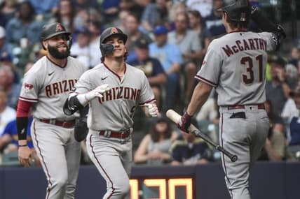 Jun 19, 2023; Milwaukee, Wisconsin, USA; Arizona Diamondbacks center fielder Alek Thomas (5) celebrates with third baseman Emmanuel Rivera (15) and right fielder Jake McCarthy (31) after hitting a two-run home run against the Milwaukee Brewers in the first inning at American Family Field. Mandatory Credit: Benny Sieu-USA TODAY Sports