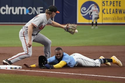 Jun 21, 2023; St. Petersburg, Florida, USA; Tampa Bay Rays center fielder Manuel Margot (13) dives safely into third as Baltimore Orioles third baseman Gunnar Henderson (2) tries to make the tag off a sacrifice fly hit by catcher Christian Bethancourt (not pictured) during the second inning at Tropicana Field. Mandatory Credit: Dave Nelson-USA TODAY Sports