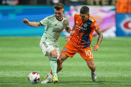 Jun 21, 2023; Atlanta, Georgia, USA; Atlanta United midfielder Amar Sejdic (13) and New York City midfielder Santiago Rodriguez (10) battle for the ball during the first half at Mercedes-Benz Stadium. Mandatory Credit: Dale Zanine-USA TODAY Sports