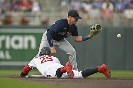 Jun 21, 2023; Minneapolis, Minnesota, USA;  Minnesota Twins designated hitter Byron Buxton (25) beats the tag of Boston Red Sox infielder Enrique Hernandez (5) for a double during the second inning at Target Field. Mandatory Credit: Nick Wosika-USA TODAY Sports