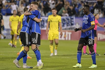 Jun 21, 2023; Montreal, Quebec, CAN;  CF Montreal defender Gabriele Corbo (25) and defender Joel Waterman (16) and midfielder Victor Wanyama (2) celebrate after the win against the Nashville SC at Stade Saputo. Mandatory Credit: Eric Bolte-USA TODAY Sports