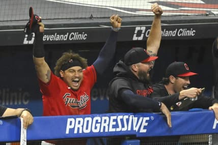 Jun 21, 2023; Cleveland, Ohio, USA; Cleveland Guardians first baseman Josh Naylor (left) celebrates after watching his brother, catcher Bo Naylor (not pictured), get his first hit in the eighth inning against the Oakland Athletics at Progressive Field. Mandatory Credit: David Richard-USA TODAY Sports