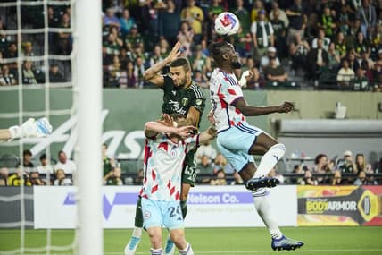 Jun 21, 2023; Portland, Oregon, USA; Chicago Fire forward Kei Kamara (23) heads the ball during the second half against Portland Timbers defender Dario Zuparic (13) at Providence Park. Mandatory Credit: Troy Wayrynen-USA TODAY Sports