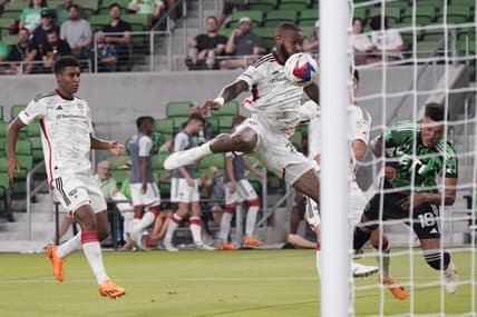 Jun 21, 2023; Austin, Texas, USA; FC Dallas defender Sebastien Ibeagha (25) and Austin FC defender Julio Cascante (18) go for a header during the second half at Q2 Stadium. Mandatory Credit: Scott Wachter-USA TODAY Sports