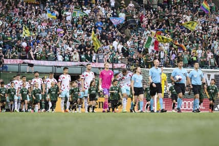 Jun 21, 2023; Portland, Oregon, USA;  The Portland Timbers and Chicago Fire make their way to the field before a game at Providence Park. Mandatory Credit: Troy Wayrynen-USA TODAY Sports