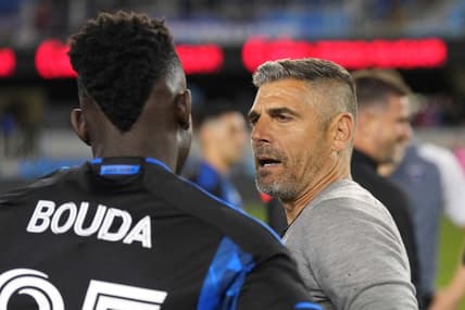 Jun 17, 2023; San Jose, California, USA; San Jose Earthquakes head coach Luchi Gonzalez (right) talks to forward Ousseni Bouda (25) after the game against the Portland Timbers at PayPal Park. Mandatory Credit: Darren Yamashita-USA TODAY Sports