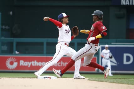 Jun 22, 2023; Washington, District of Columbia, USA; Washington Nationals shortstop CJ Abrams (5) tags out Arizona Diamondbacks shortstop Geraldo Perdomo (2) on second base and throws the ball to first during the first inning at Nationals Park. Mandatory Credit: Amber Searls-USA TODAY Sports