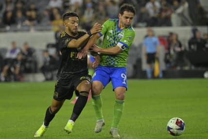 Jun 21, 2023; Los Angeles, California, USA; (EDITORS NOTE: Caption correction) Seattle Sounders midfielder Nicolas Lodeiro (9) fights for the ball against Los Angeles FC forward Denis Bouanga (99) during the game at BMO Stadium. Mandatory Credit: Jayne Kamin-Oncea-USA TODAY Sports