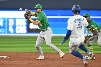 Jun 23, 2023; Toronto, Ontario, CAN;   Oakland Athletics shortstop Tyler Wade (8) loses the ball after forcing out Toronto Blue Jays right fielder George Springer (4) at second base in the third inning at Rogers Centre. Mandatory Credit: Dan Hamilton-USA TODAY Sports