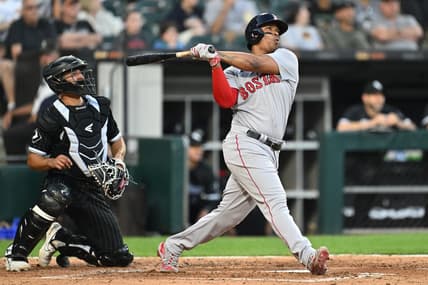 Jun 23, 2023; Chicago, Illinois, USA; Boston Red Sox infielder Rafael Devers (11) hits a two-run home run in the fourth inning against the Chicago White Sox at Guaranteed Rate Field. Mandatory Credit: Jamie Sabau-USA TODAY Sports