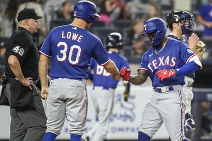 Jun 23, 2023; Bronx, New York, USA;  Texas Rangers right fielder Adolis Garcia (53) celebrates with first baseman Nathaniel Lowe (30) after hitting a two run home run in the tenth inning against the New York Yankees at Yankee Stadium. Mandatory Credit: Wendell Cruz-USA TODAY Sports
