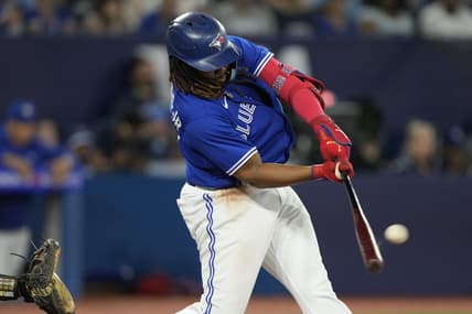 Jun 24, 2023; Toronto, Ontario, CAN; Toronto Blue Jays first baseman Vladimir Guerrero Jr. (27) hits a two run home run against the Oakland Athletics during the sixth inning at Rogers Centre. Mandatory Credit: John E. Sokolowski-USA TODAY Sports
